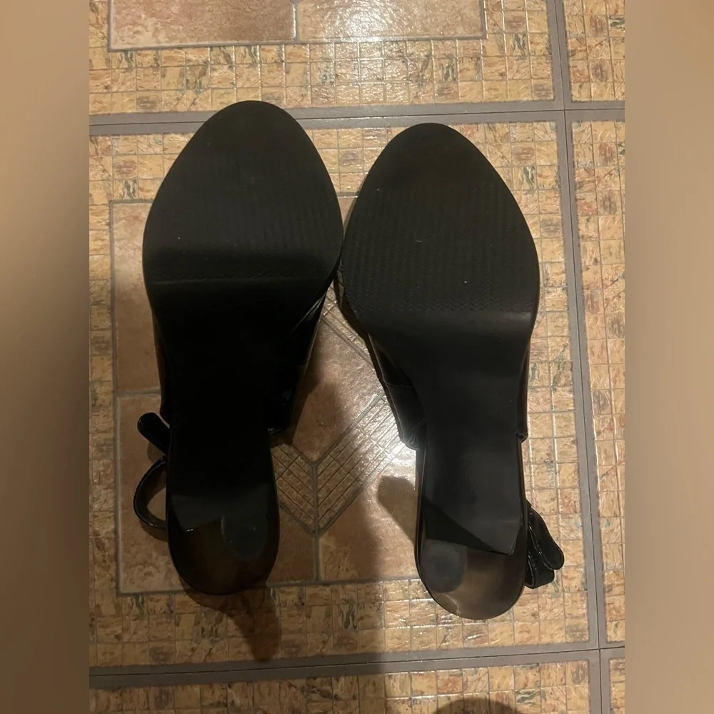 Coach and four Black heels